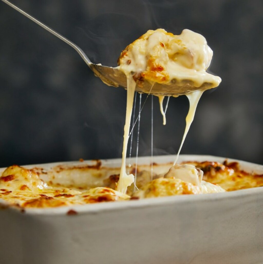 low carb cauliflower cheese being dished up